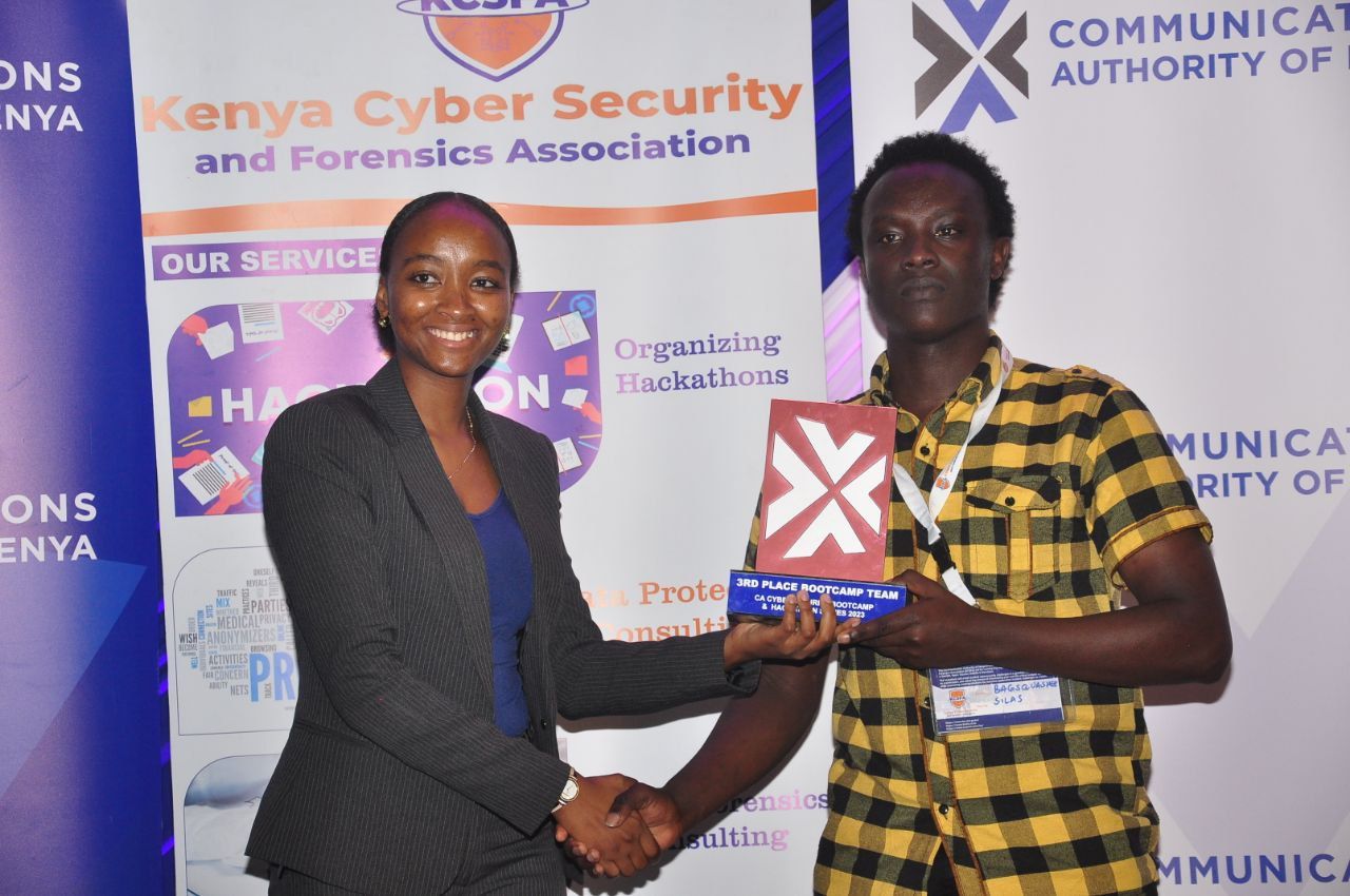 Silas receiving the 3rd place bootcamp team trophy at the CA Cyber Security Bootcamp and Hackathon 2023